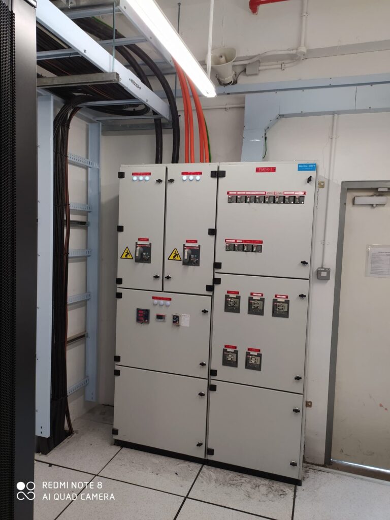 Professional residential electrician troubleshooting HDB wiring issues in a Singapore apartment.